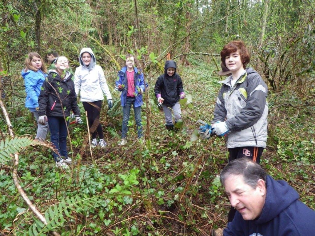 A hardy crew helping pull ivy.